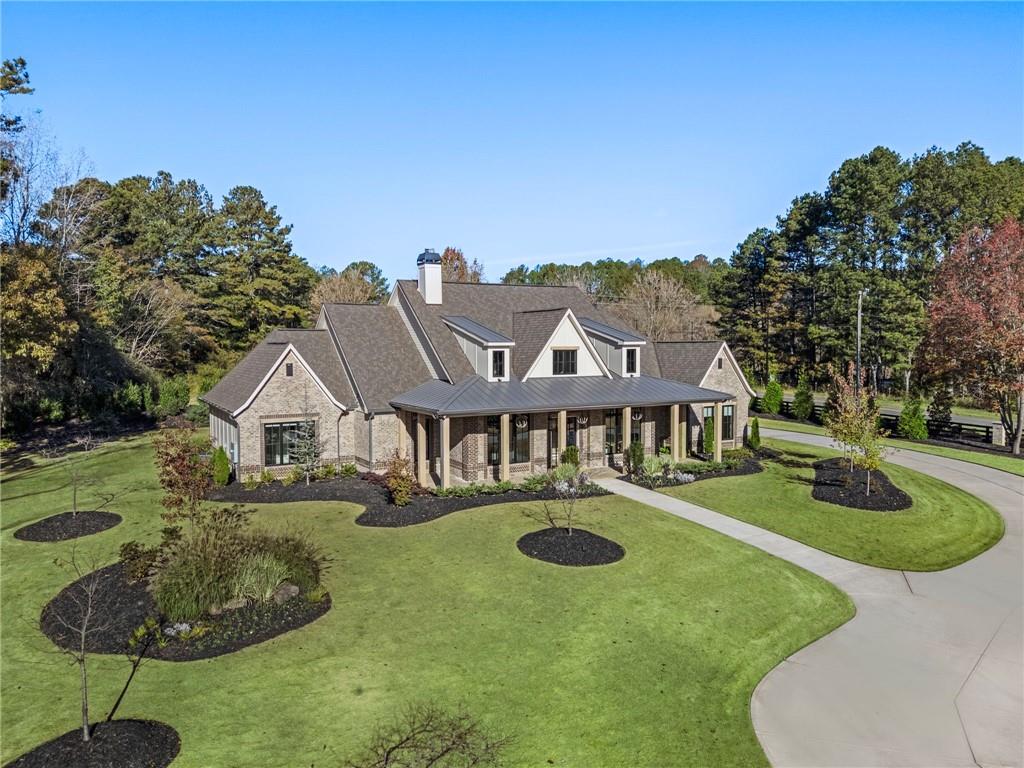 1000 Haddie Way Alpharetta, GA 30004 - Photo 5 of 95 a front view of a house with a yard