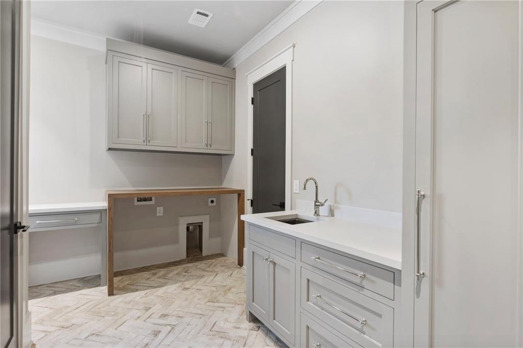 1000 Haddie Way Alpharetta, GA 30004 - Photo 51 of 95 a kitchen with a sink and cabinets