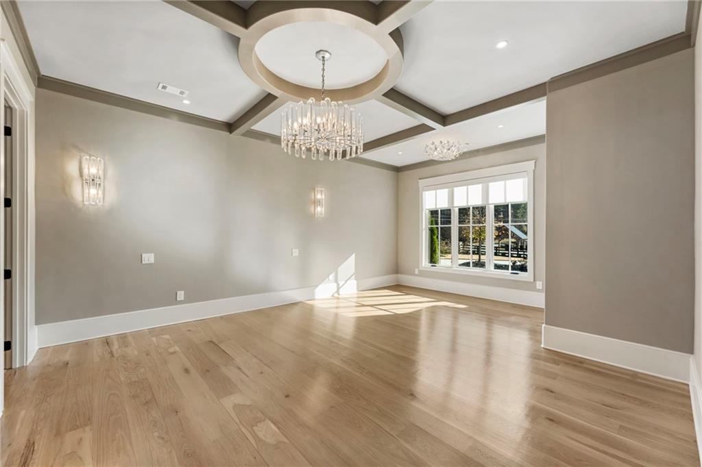 1000 Haddie Way Alpharetta, GA 30004 - Photo 53 of 95 a view of an empty room with wooden floor and a window