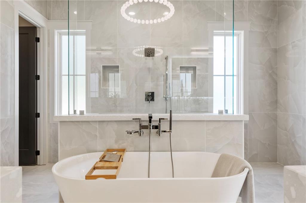 1000 Haddie Way Alpharetta, GA 30004 - Photo 62 of 95 a bathroom with a tub and shower
