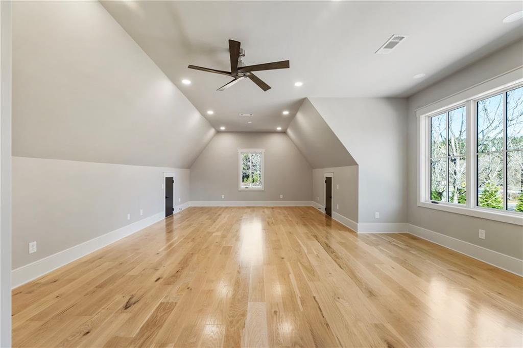 1000 Haddie Way Alpharetta, GA 30004 - Photo 77 of 95 wooden floor in an empty room with a window
