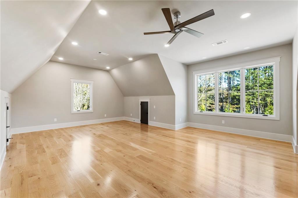 1000 Haddie Way Alpharetta, GA 30004 - Photo 78 of 95 an empty room with windows and ceiling fan