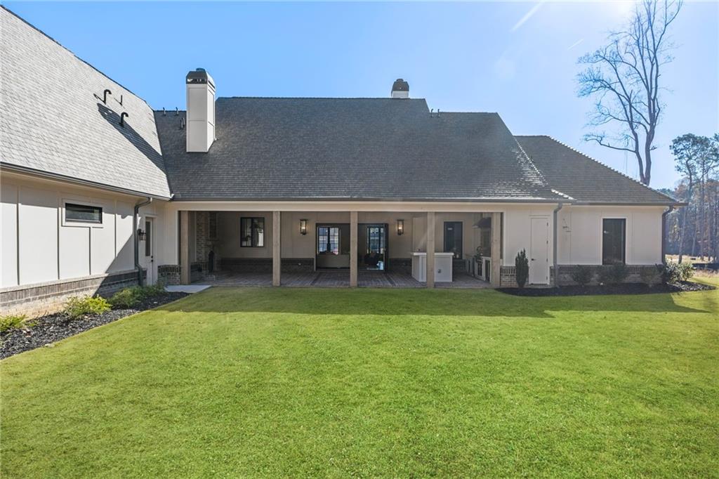 1000 Haddie Way Alpharetta, GA 30004 - Photo 82 of 95 a front view of a house with a garden and porch