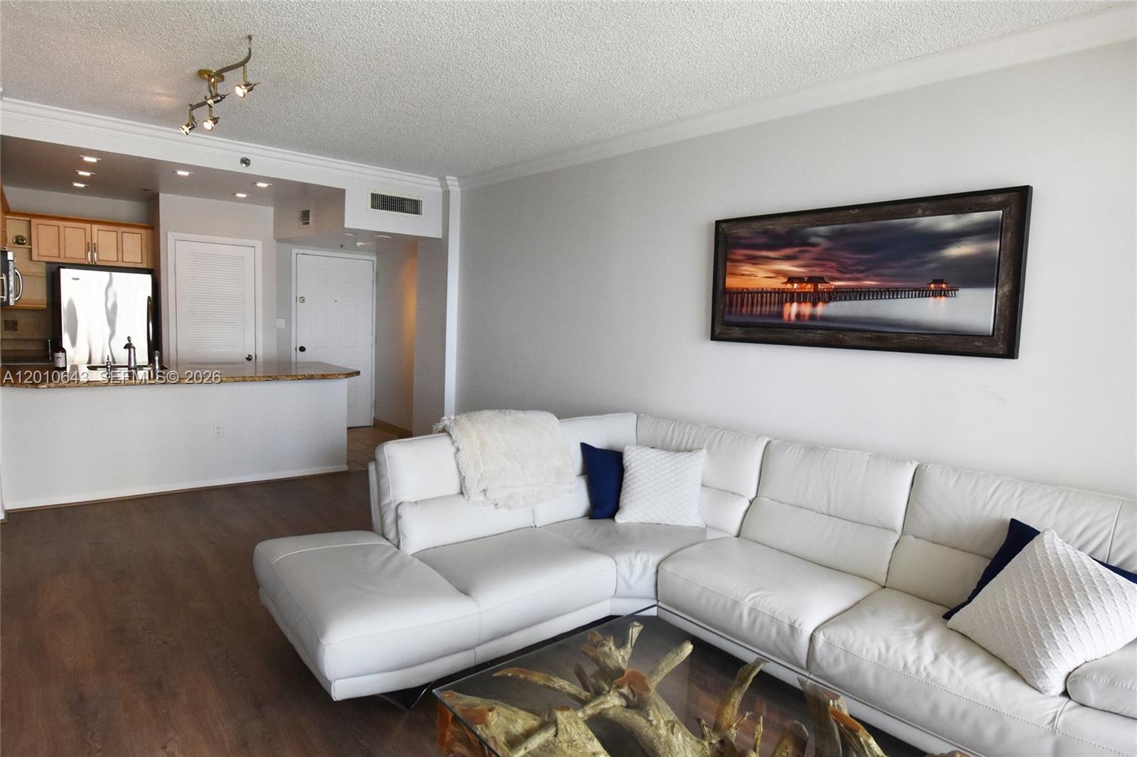 540 Brickell Key Drive, Unit PH1812 Miami, FL 33131 - Photo 2 of 29 a living room with furniture and a couch