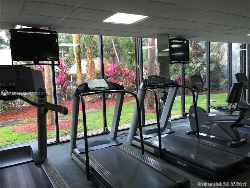 540 Brickell Key Drive, Unit PH1812 Miami, FL 33131 - Photo 21 of 29 a view of a room with gym equipment