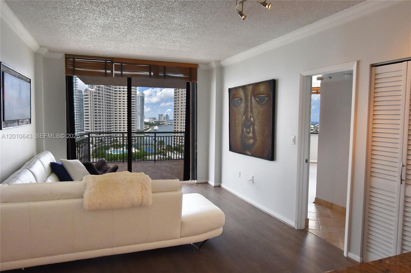 540 Brickell Key Drive, Unit PH1812 Miami, FL 33131 - Photo 4 of 29 a living room with furniture and large windows