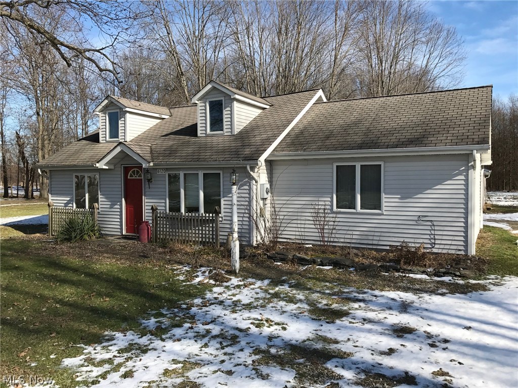 6120 Shaffer Road Northwest Warren, OH 44481 - Photo 1 of 24 Front view looking east showing the 2 bedroom, single family house with vinyl siding, replacement windows and doors. The 19' x 15' family room with radiant floor heat and vaulted ceiling is on the right side.
