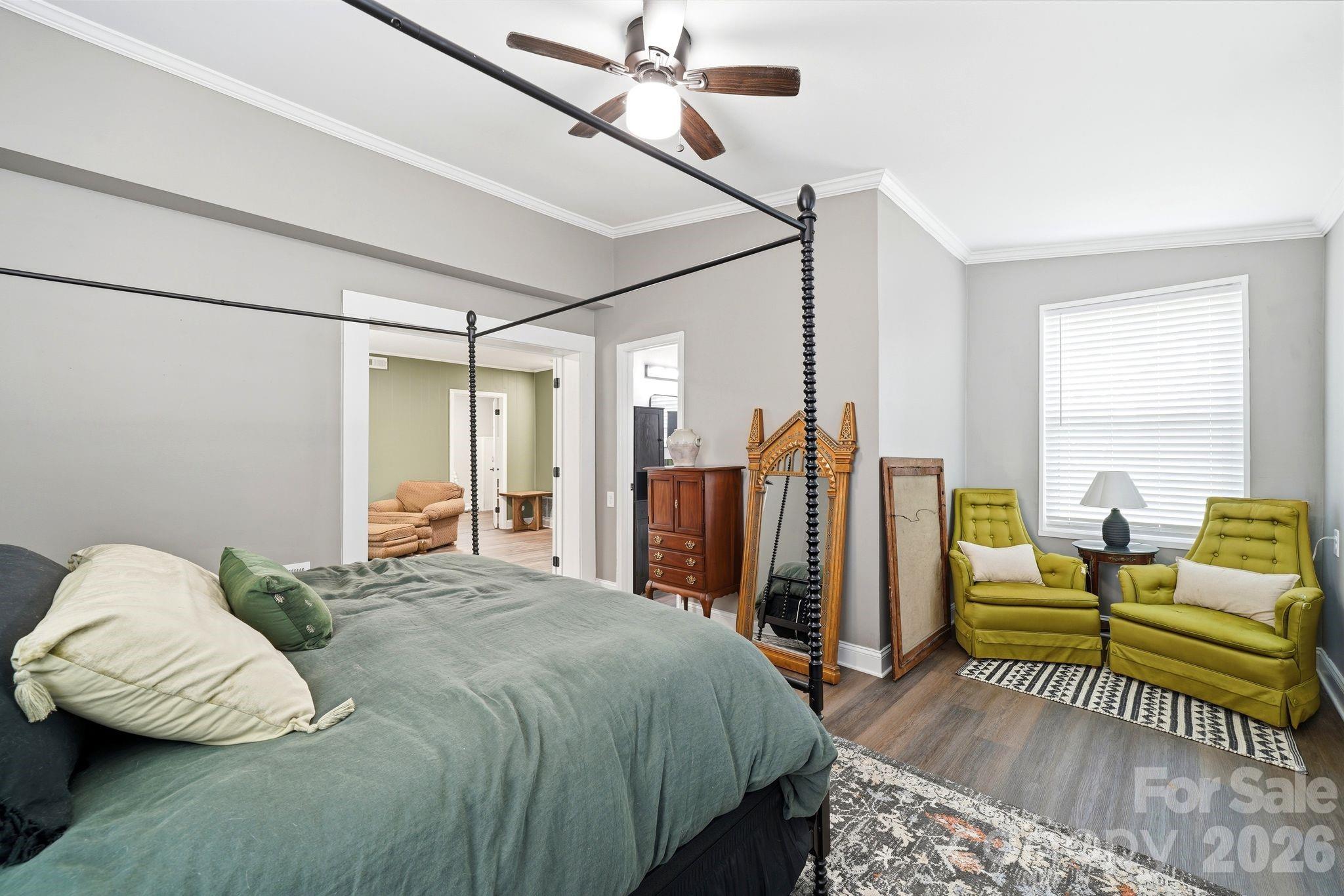 7552 Idlewild Road Charlotte, NC 28212 - Photo 18 of 40 a bedroom with a bed couch and a window