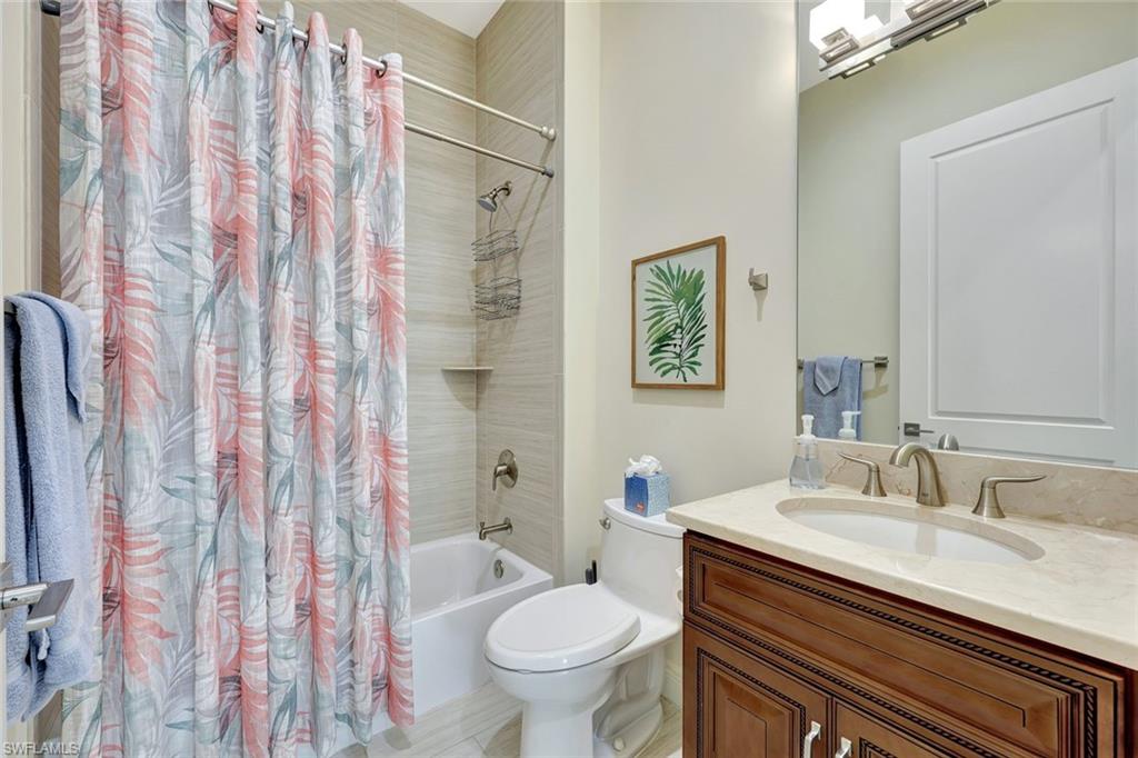 608 El Camino Real, Unit 202 Naples, FL 34119 - Photo 21 of 46 Ensuite guest bathroom featuring shower/tub combo