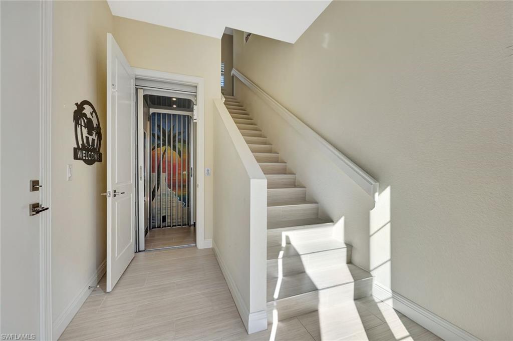 608 El Camino Real, Unit 202 Naples, FL 34119 - Photo 26 of 46 Choose private elevator or tiled stairs!