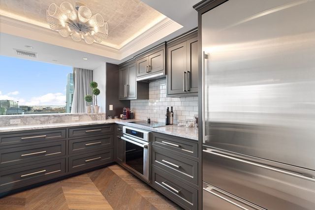 a kitchen with a sink and cabinets