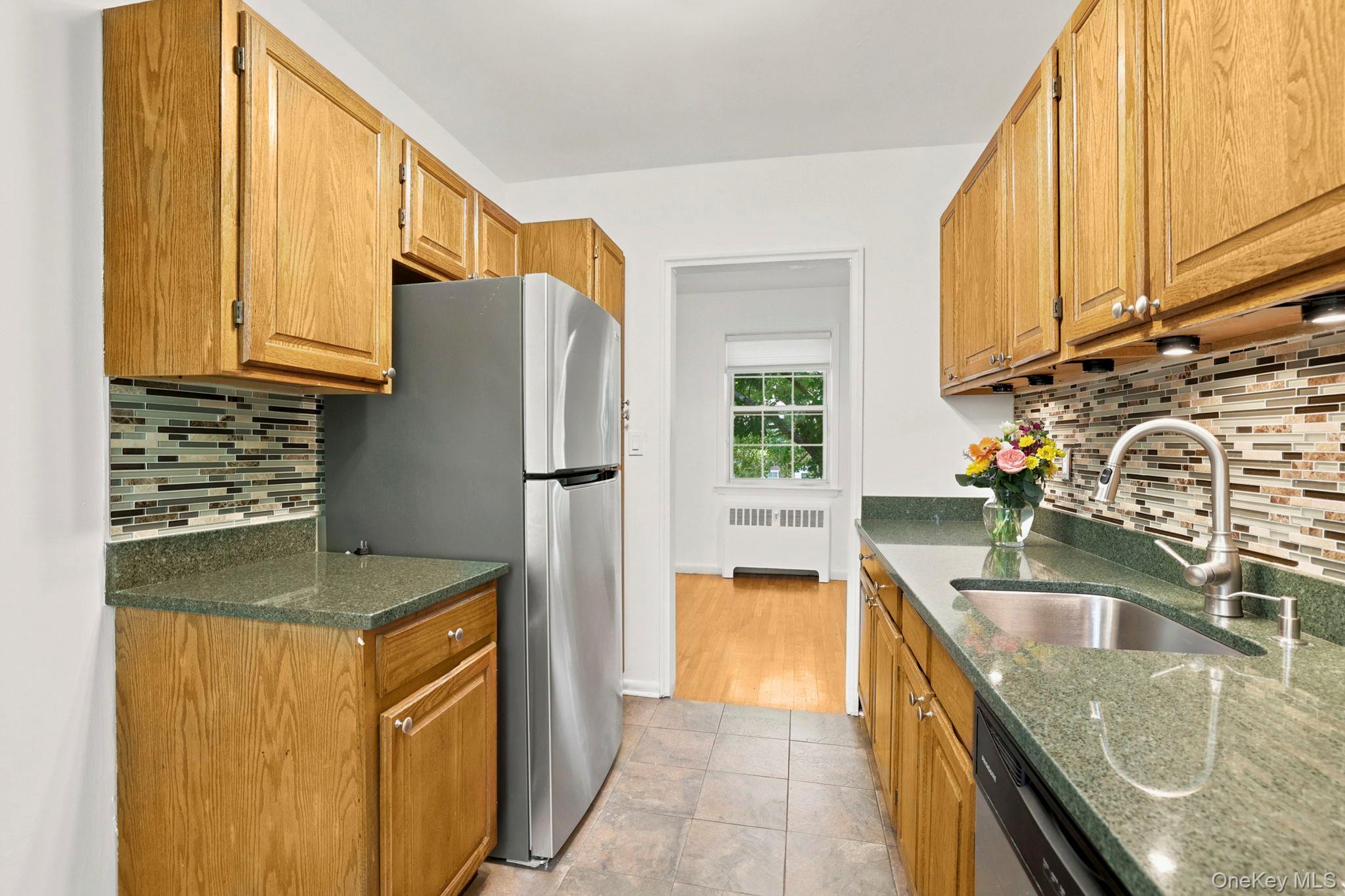 186 Pinewood Road, Unit 56 Hartsdale, NY 10530 - Photo 9 of 29 This is the view of the eat-in kitchen, looking out to the dining room area that is adjacent to the kitchen