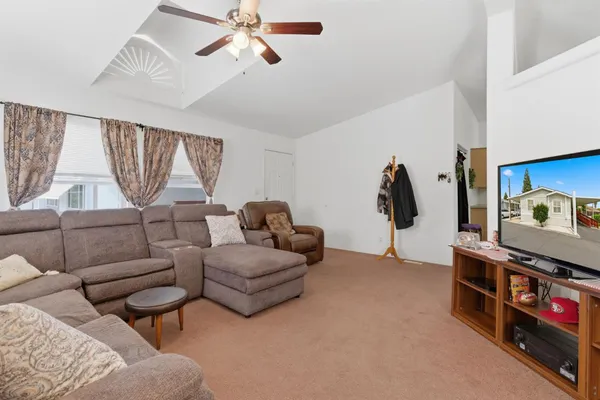 a living room with furniture and a window