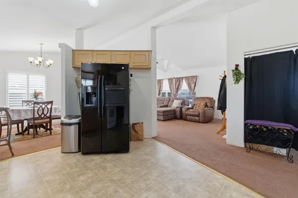 a living room with furniture and a flat tv screen
