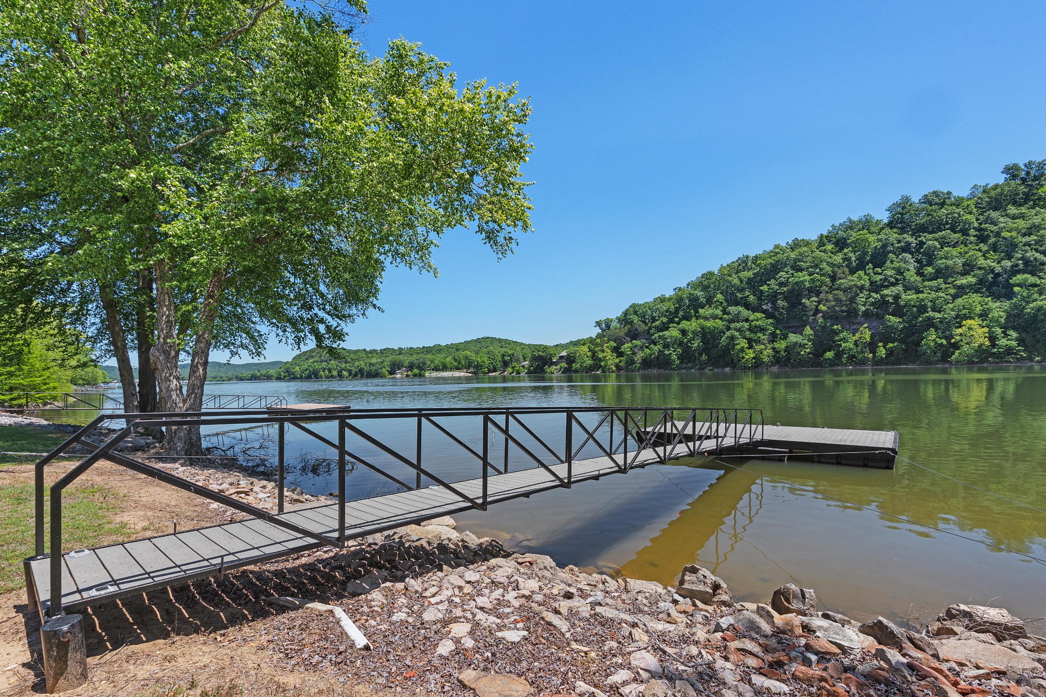 958 Pevahouse Camp Lane Decaturville, TN 38329 - Photo 2 of 32 a view of a swimming pool with a patio