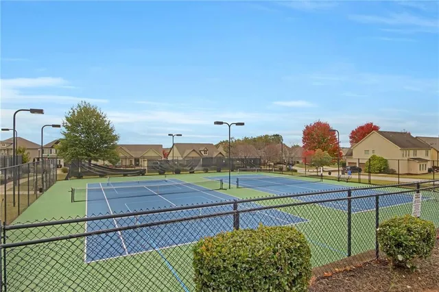 a view of an outdoor space and tennis court