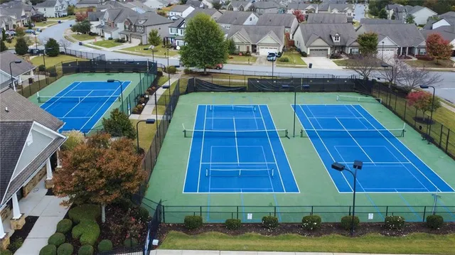 an aerial view of residential houses with outdoor space