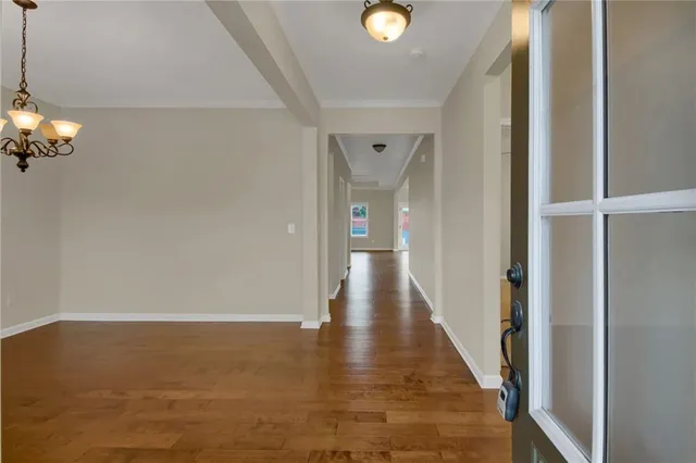 a view of a livingroom from a hallway