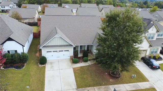 an aerial view of a house with a swimming pool