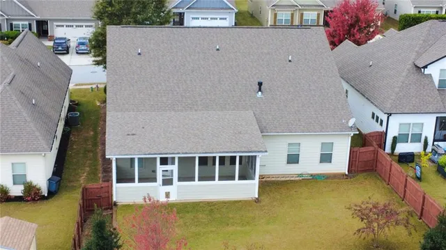 an aerial view of a house with swimming pool