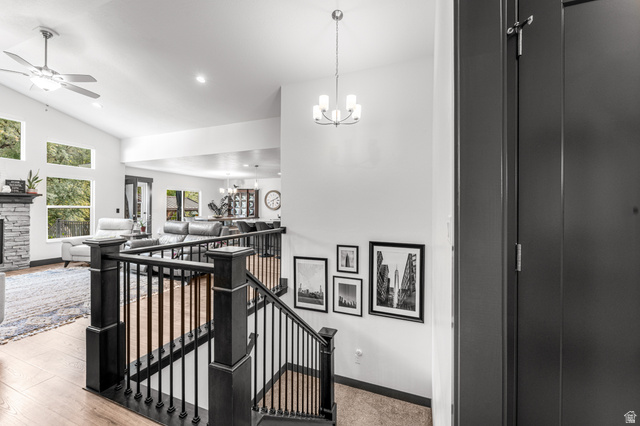 313 Old Maple Road South Weber, UT 84405 - Photo 6 of 35 Split-level entry with dark wood-finish staircase and wrought iron balusters
