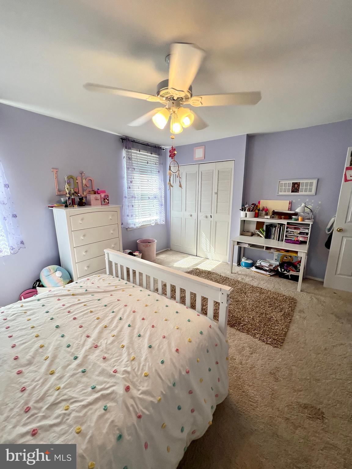 6256 Madison Court Bensalem, PA 19020 - Photo 5 of 14 a bedroom with a bed and a chandelier