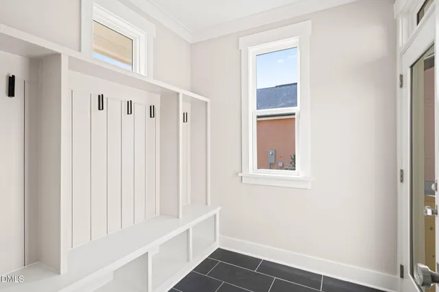 a view of a livingroom with wooden floor a fireplace and window
