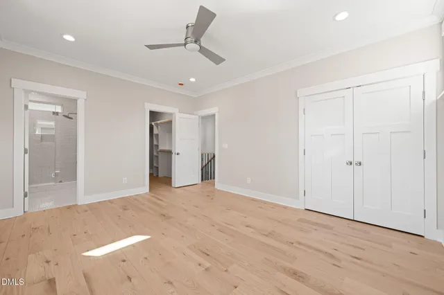 a bathroom with a double vanity sink mirror and shower