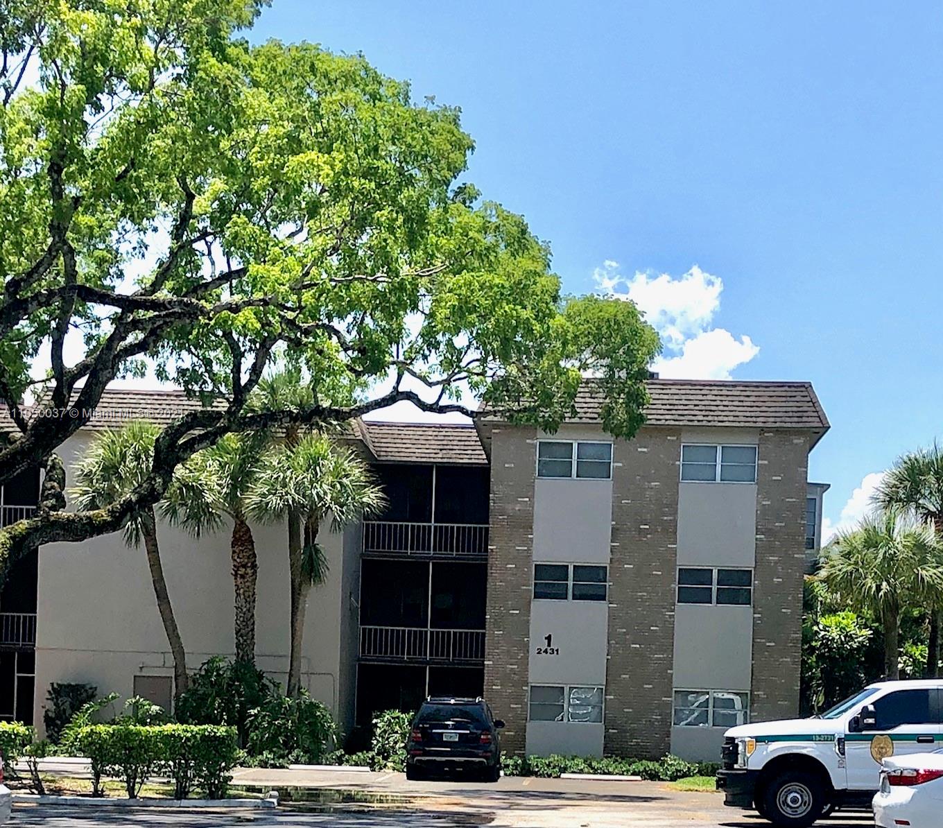 a view of a car parked in front of a building