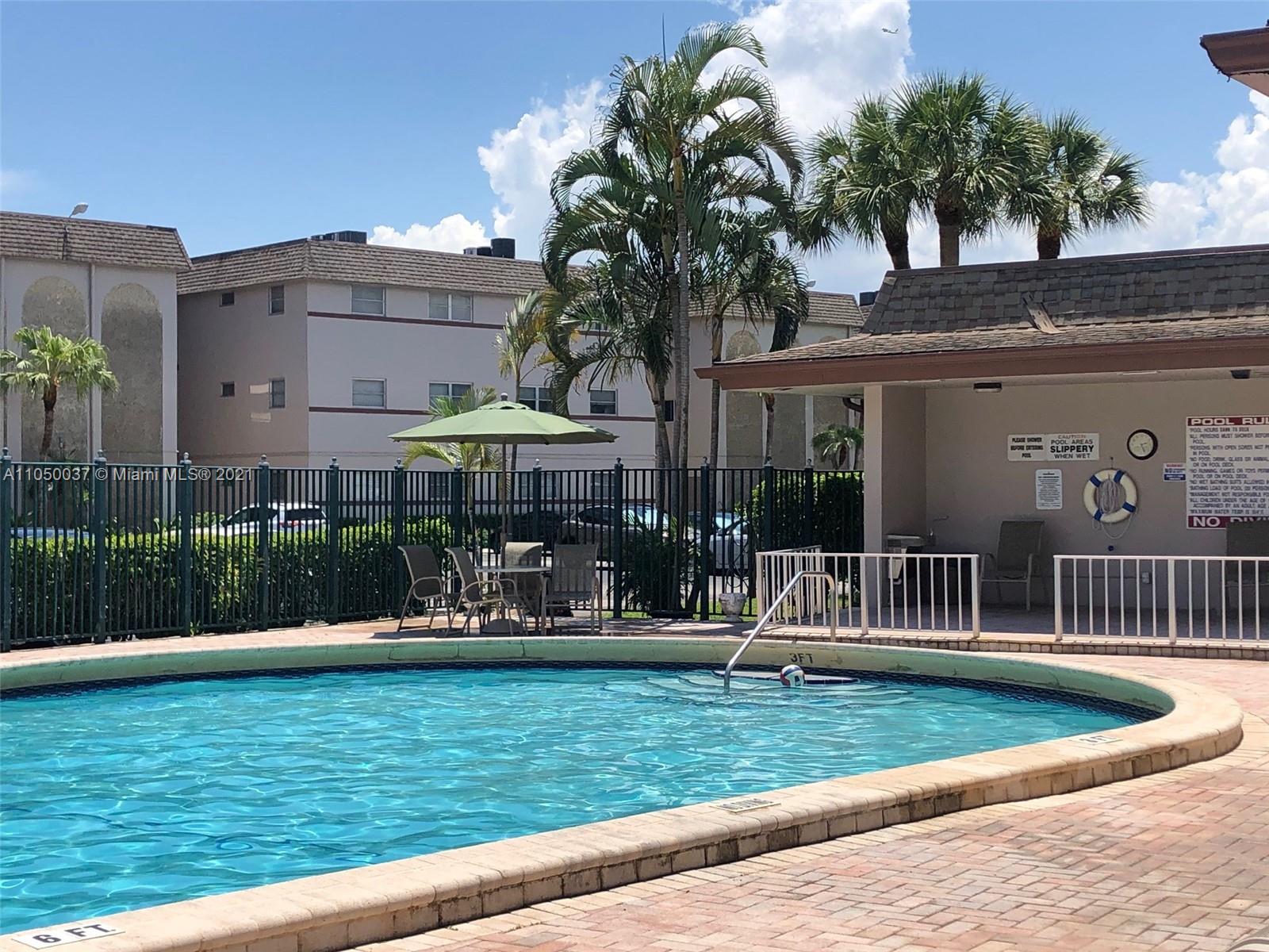 Arrowhead Davie, FL 33324 - Photo 13 of 21 a front view of a house with garden