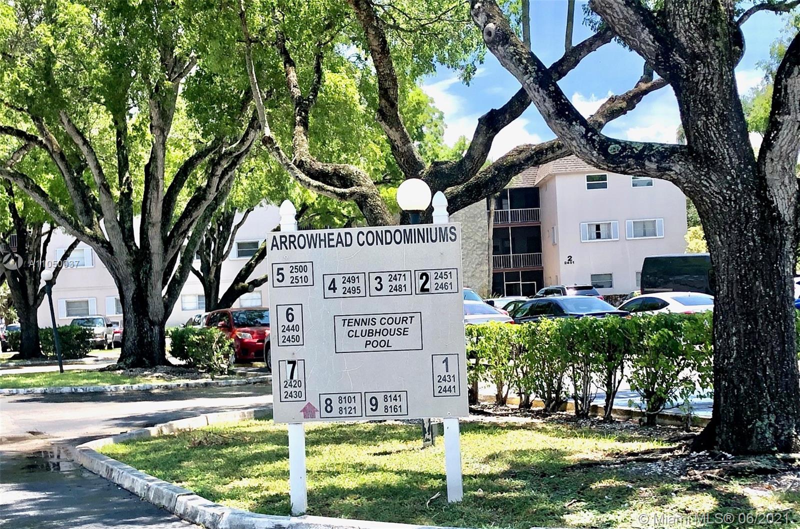 Arrowhead Davie, FL 33324 - Photo 3 of 21 a view of a white house with a large tree and a yard with plants