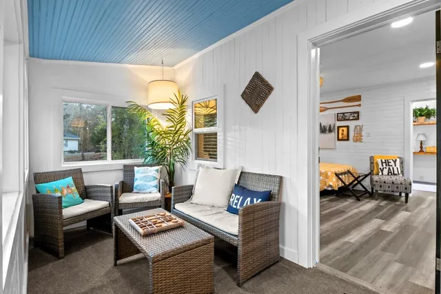 a kitchen with sink cabinets and wooden floor
