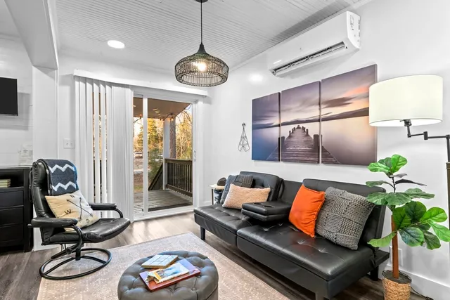 a kitchen with granite countertop a sink cabinets and stainless steel appliances