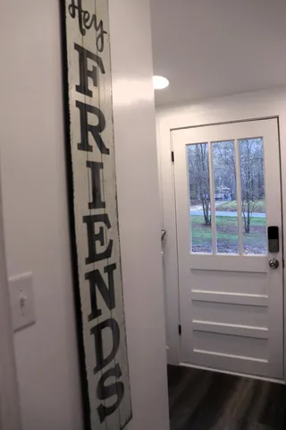 a bathroom with a toilet a sink and a mirror