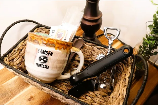 a bedroom with two beds and painting on the wall