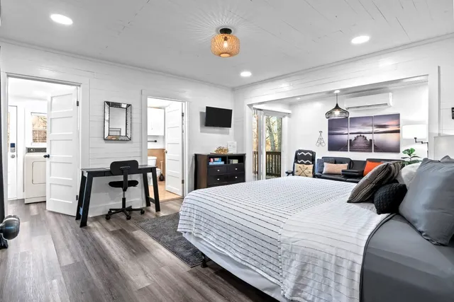 a view of a lounge chair and couch on the wall