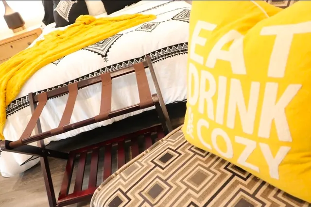a view of a patio with table and chairs under an umbrella