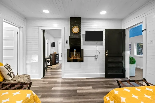a view of a chairs and tables in the back yard of the house