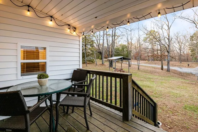 a view of house with a yard