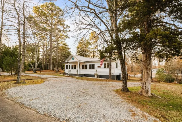 a view of living room kitchen and entryway