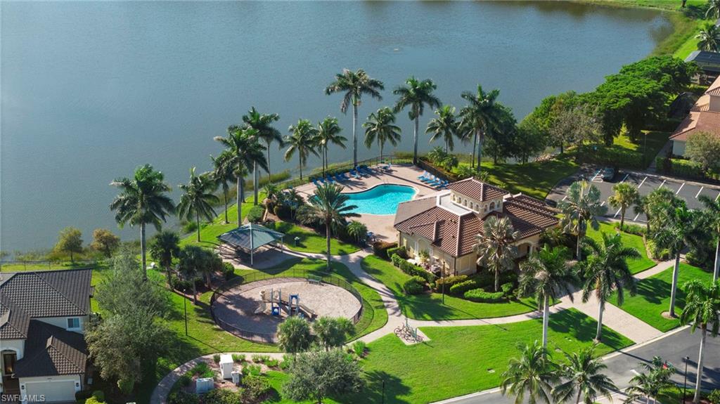 8286 Sumner Avenue, Unit 1 Fort Myers, FL 33908 - Photo 12 of 13 Aerial view of a pool and a nearby body of water