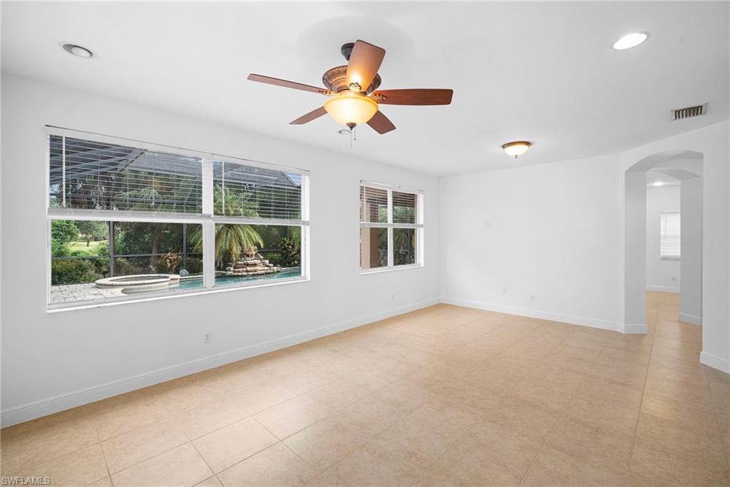 8286 Sumner Avenue, Unit 1 Fort Myers, FL 33908 - Photo 5 of 13 Family room with arched walkways, healthy amount of natural light, recessed lighting, and a ceiling fan