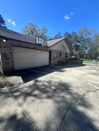 a view of a house with a snow in the yard
