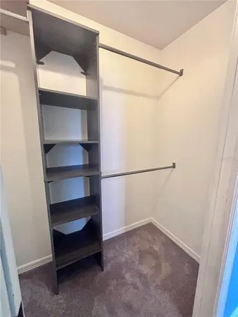 a view of an empty walk in closet