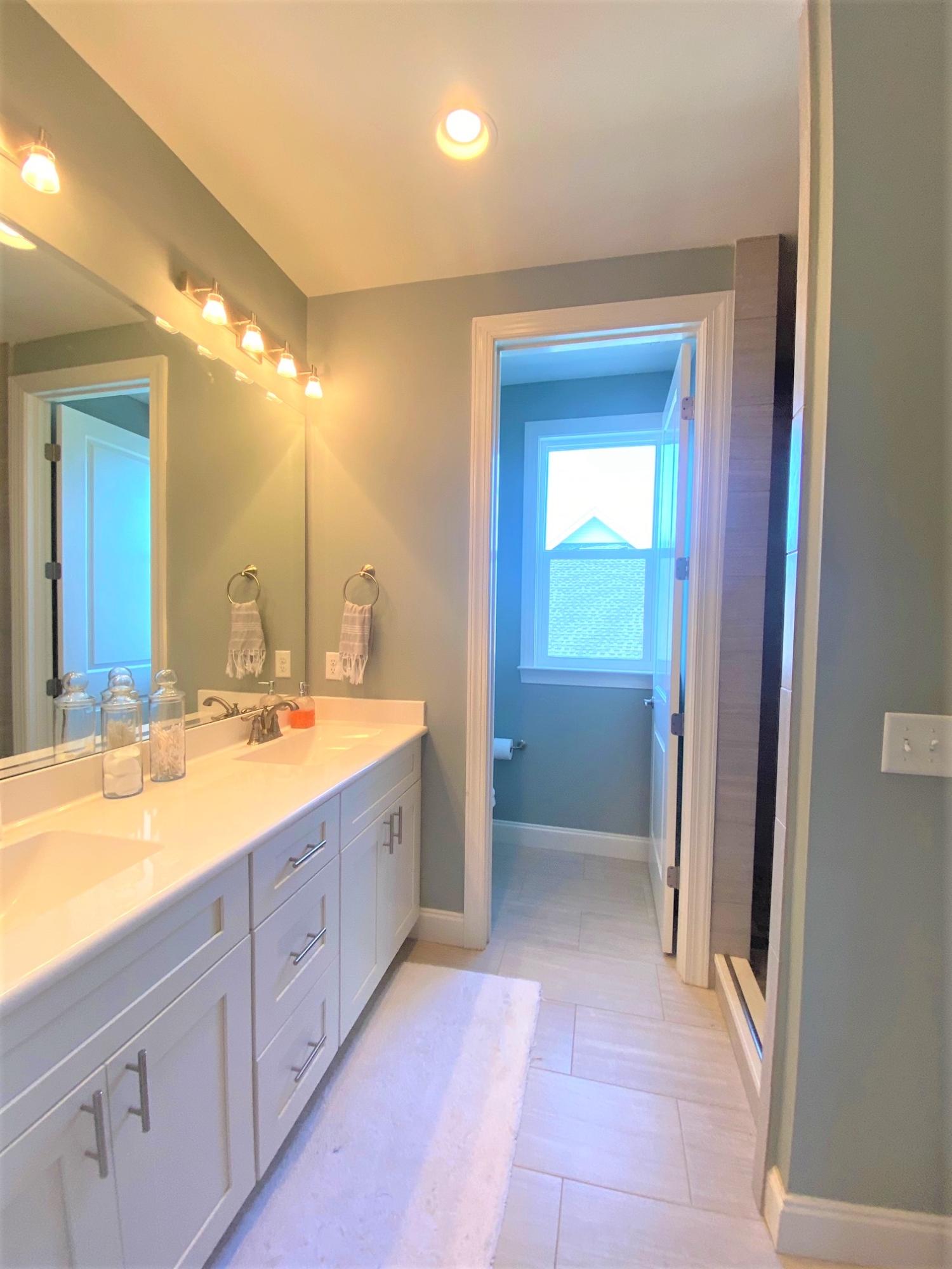 64 Hatton Court Santa Rosa Beach, FL 32459 - Photo 11 of 37 a bathroom with a granite countertop sink mirror and bathtub