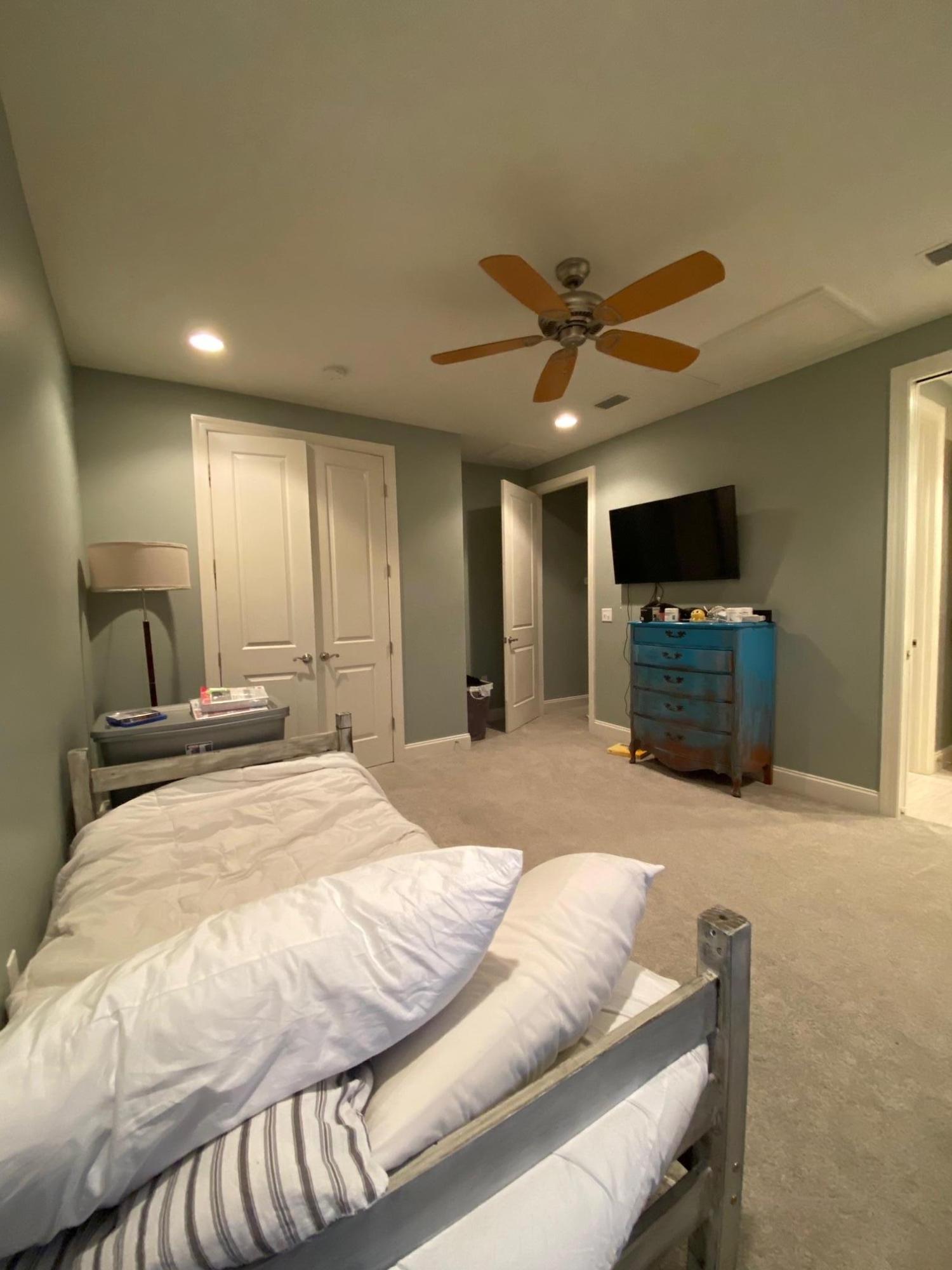 64 Hatton Court Santa Rosa Beach, FL 32459 - Photo 18 of 37 a spacious bedroom with a bed and a television in it