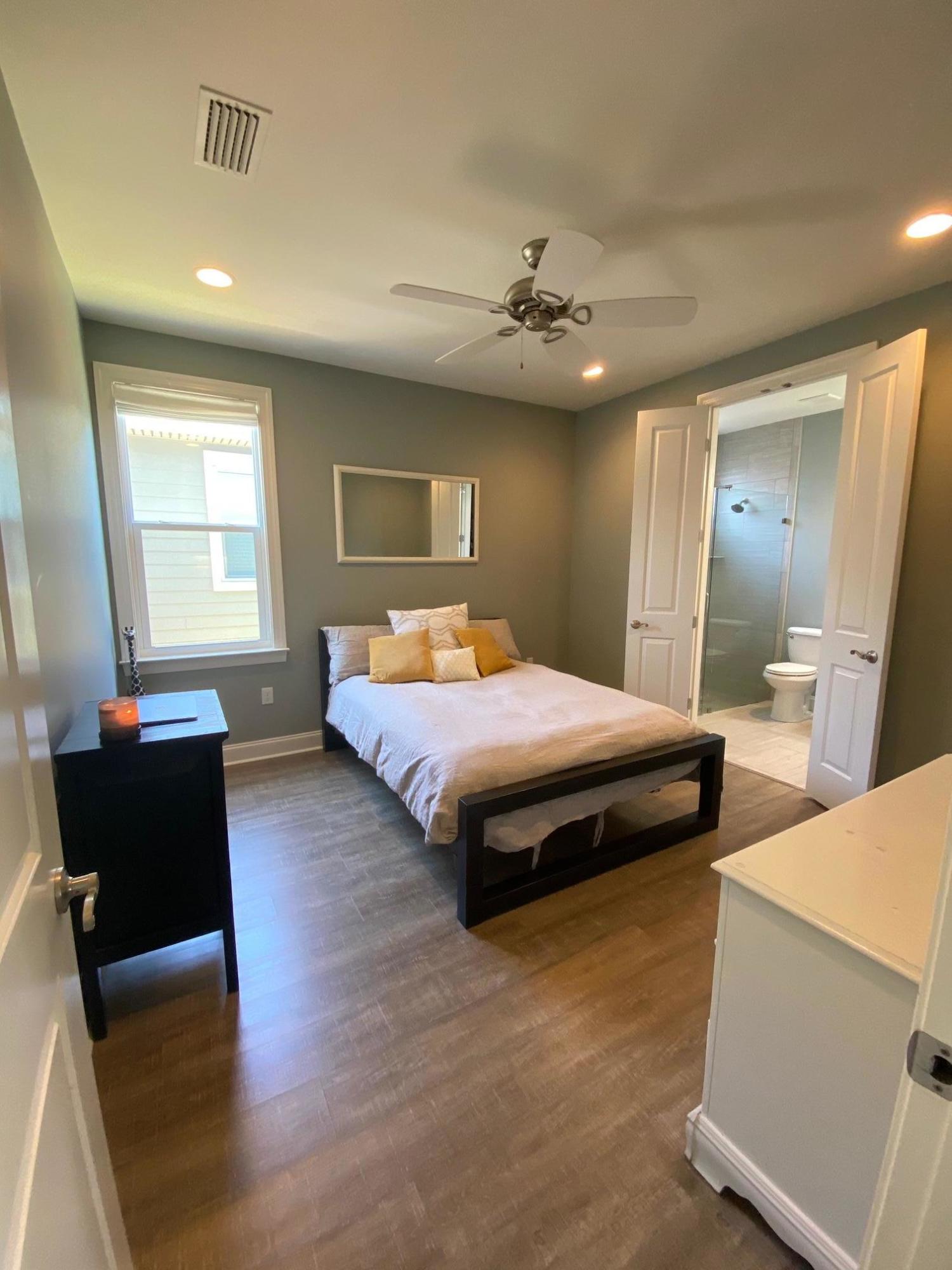 64 Hatton Court Santa Rosa Beach, FL 32459 - Photo 21 of 37 a bedroom with a bed and wooden floor