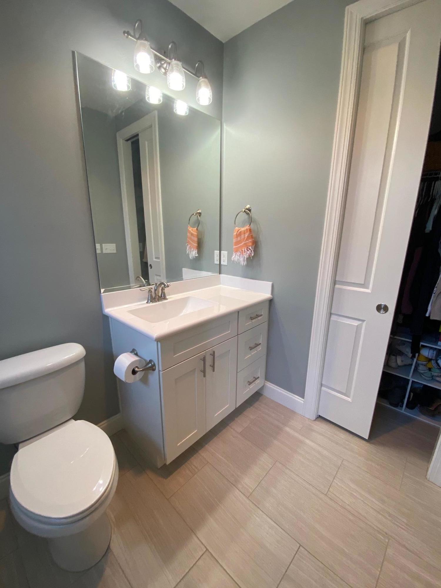 64 Hatton Court Santa Rosa Beach, FL 32459 - Photo 23 of 37 a bathroom with a toilet sink and mirror