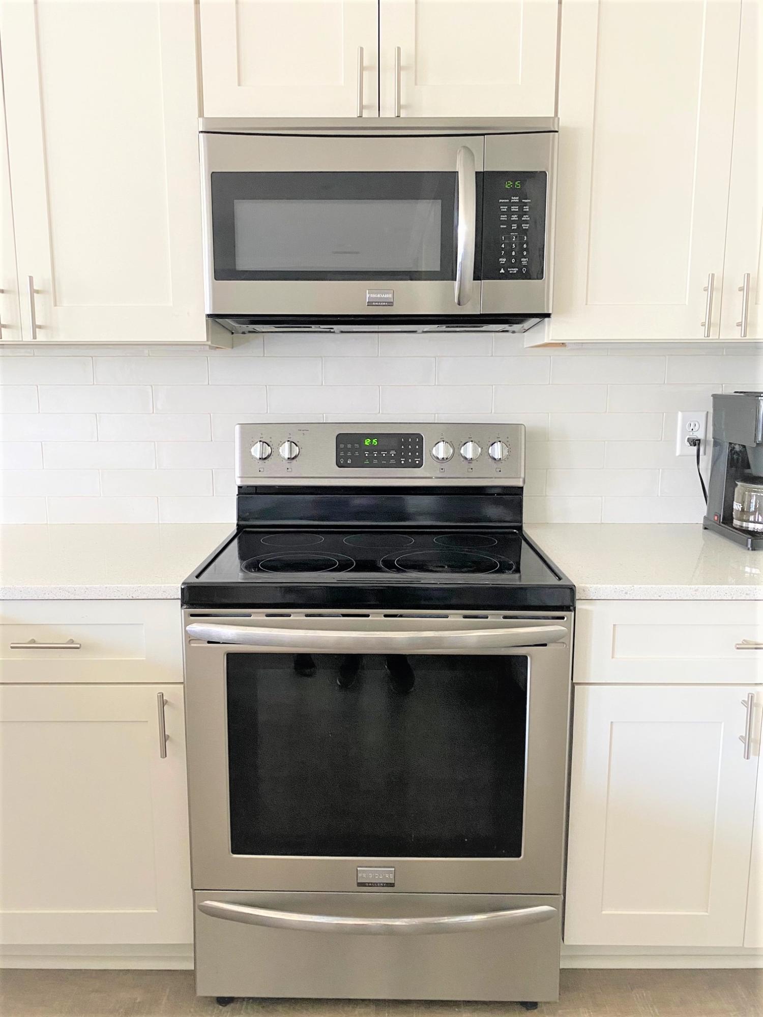 64 Hatton Court Santa Rosa Beach, FL 32459 - Photo 8 of 37 a stove top oven sitting inside of a kitchen and granite counter tops