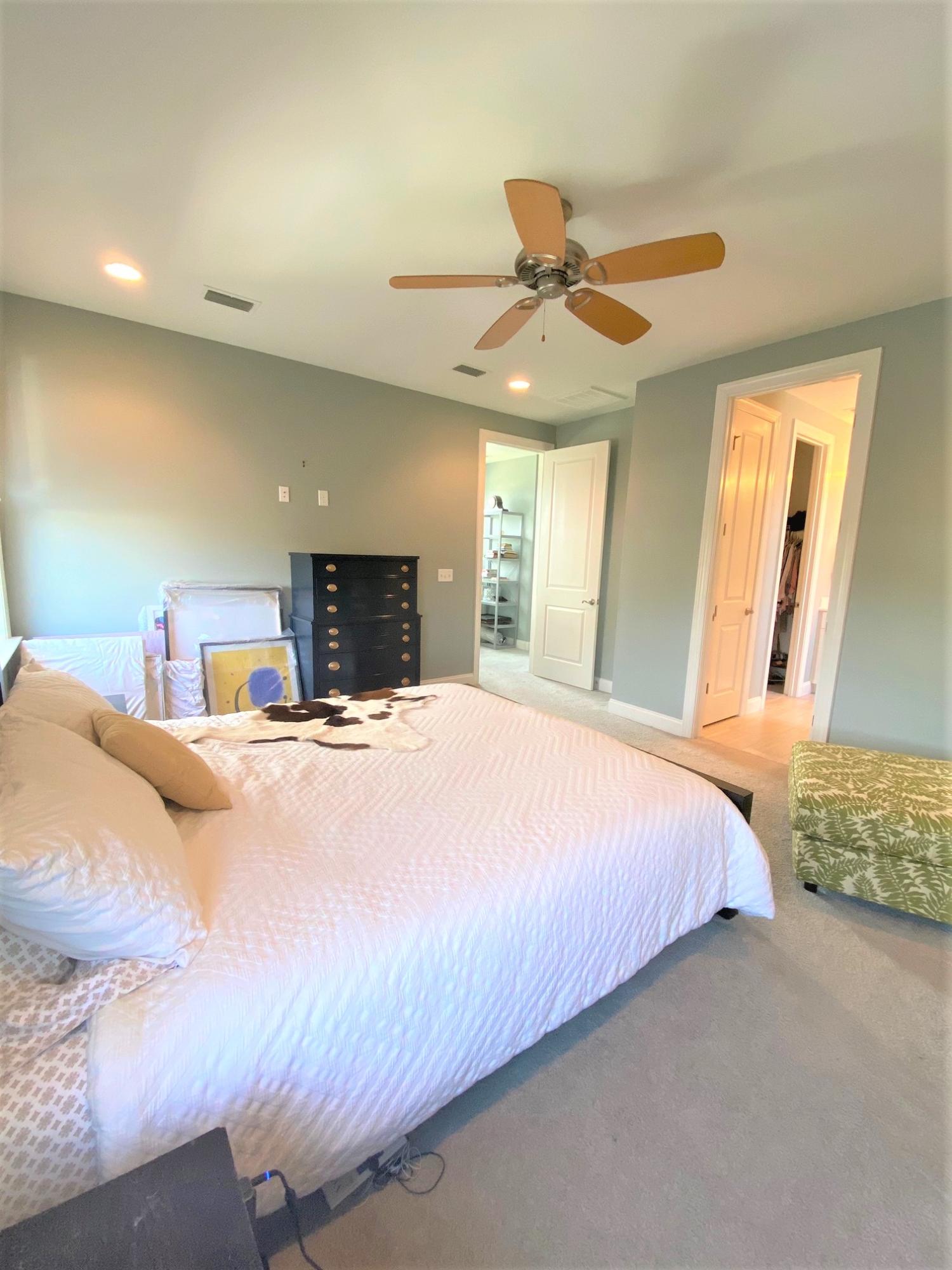 64 Hatton Court Santa Rosa Beach, FL 32459 - Photo 10 of 37 a bedroom with a large bed and a chandelier